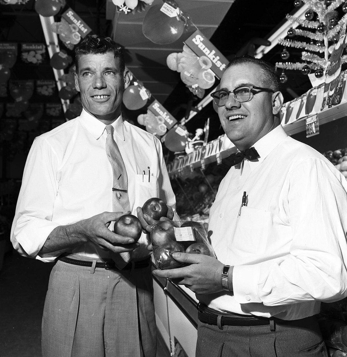 Nov. 12, 1958: Thomas Hornsby, left, produce manager, and J.E. Hackney, produce buyer, show a variety of produce at easy accessible counters at the new Buddies super market at the southeast intersection of Jacksboro and N.W. 28th.