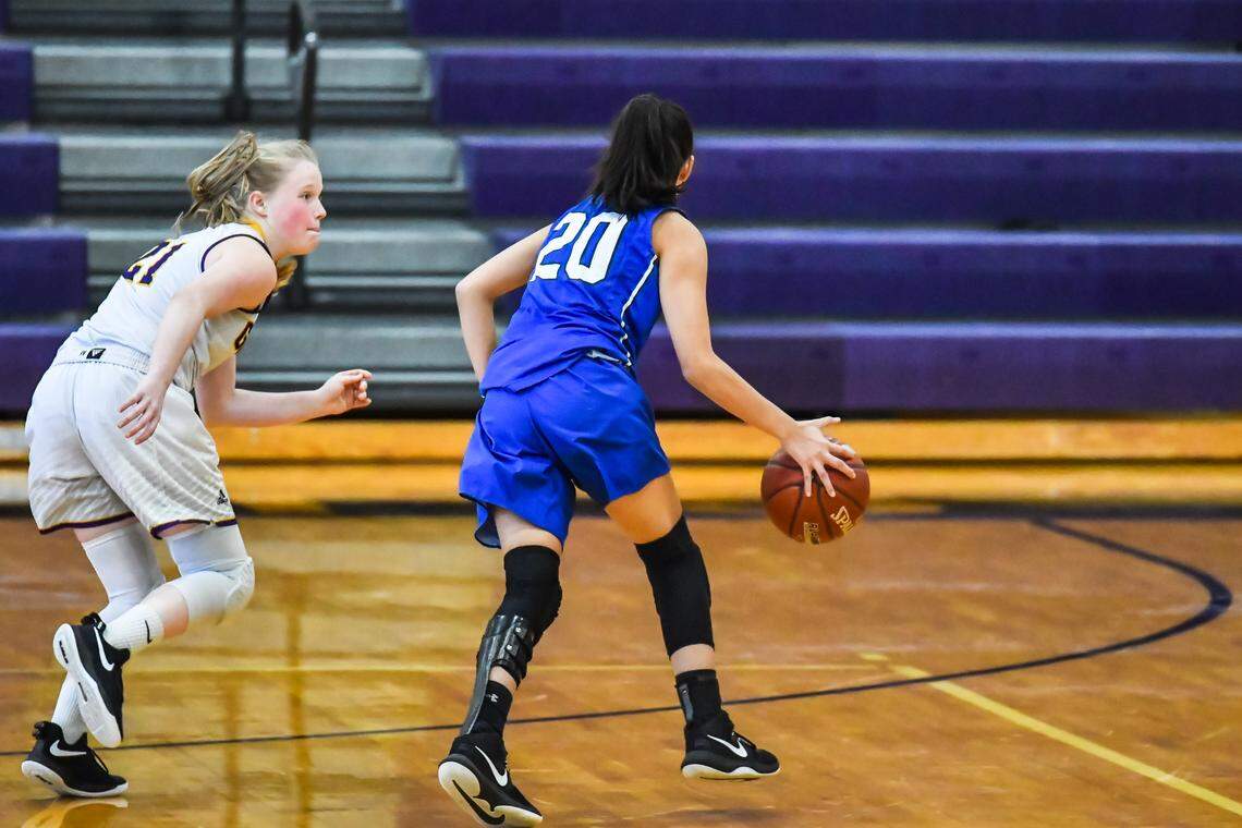 Joshua sophomore Gabbie Guerrero, right, dribbles the ball against Godley in a non-district game, Tuesday Dec. 31, 2019.