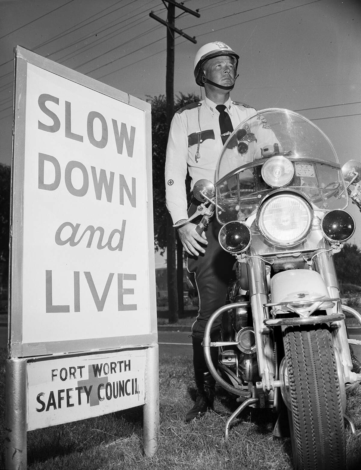 1958: A pair of Reminders - “Slow Down and Live” is the Fort Worth Safety Council’s slogan of warning to the Memorial Day weekend drivers through Labor Day. Police Officers J.L. Cashion will have his motorcycle ready to chase down speeders, too.