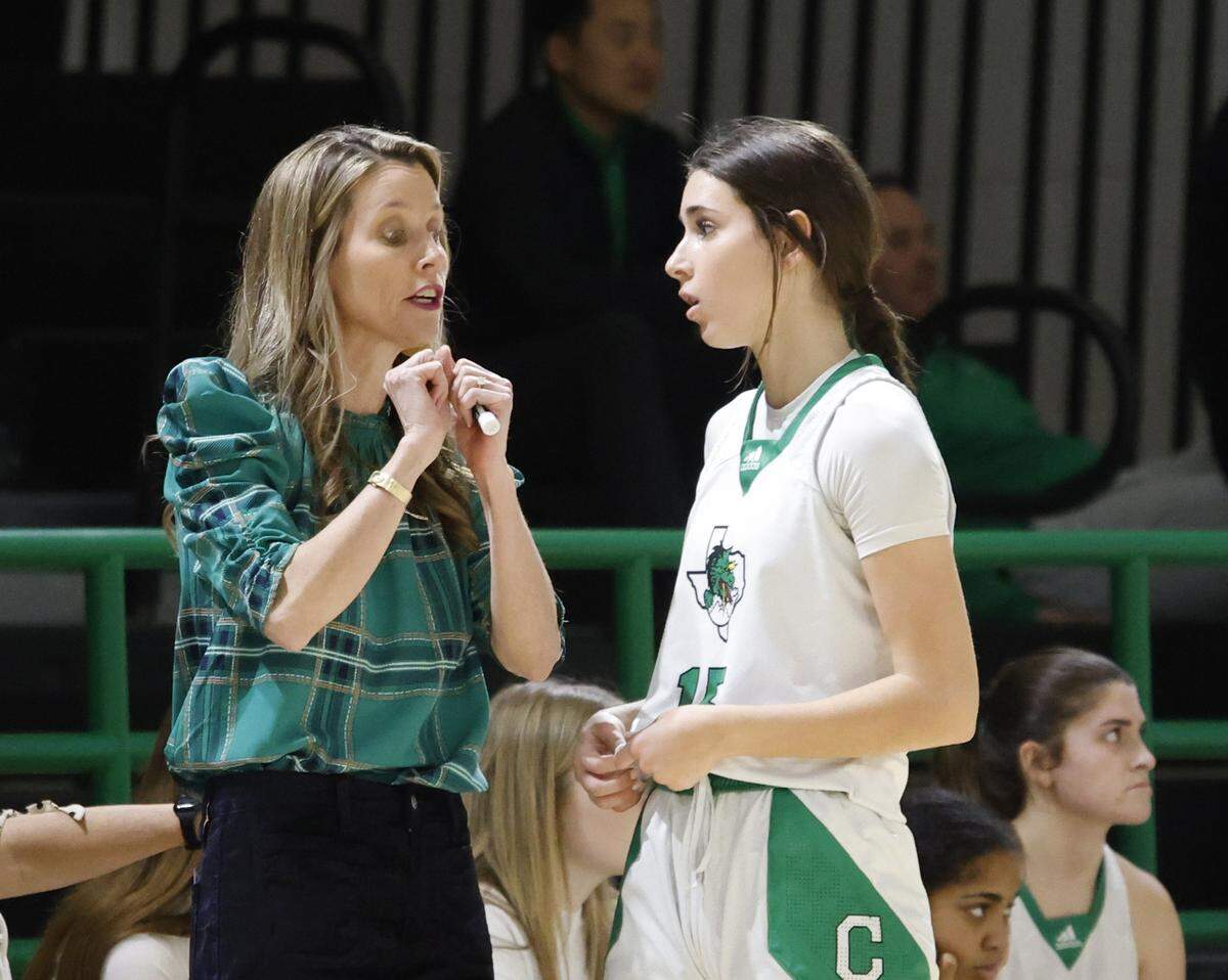 Southlake head coach Robyn McCoart talks to guard Angelina Bouley (15) near the bench during the second half of a UIL girls basketball game between L.D. Bell and Southlake Carroll at Southlake Senior High School in Southlake, Texas, Tuesday Feb. 03, 2026