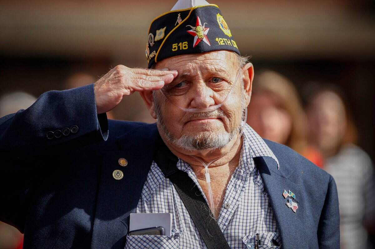 Nov. 11, 2015: Ken Cox, a retired Air Force senior master sergeant, salutes during the National Anthem during a Veterans Day parade in downtown Fort Worth.