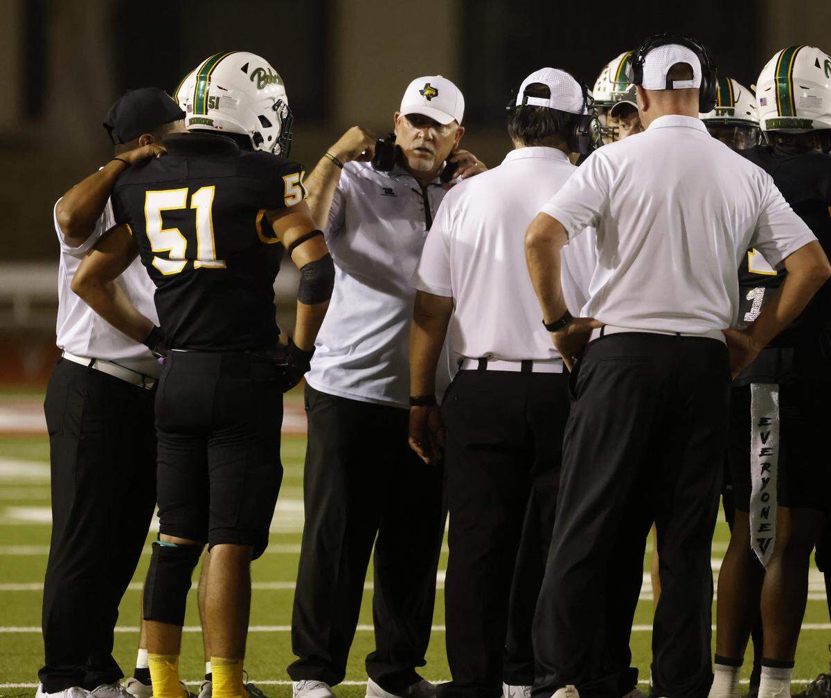 Benbrook head coach Cody Slater talks to the team during a time out during the first half of a UIL football game between Eagle Mountain and Benbrook at Farrington Field in Fort Worth, Texas, Friday, Sept. 26, 2025.