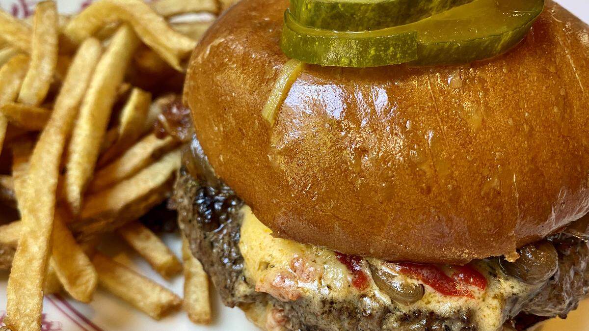 The “Fort Worth burger” at Bird Café has pimiiento cheese, bacon and onions.