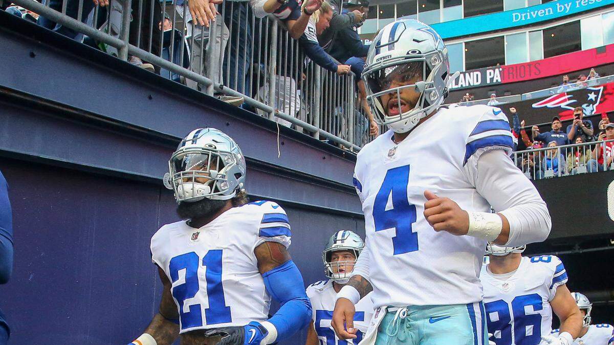 Dallas Cowboys quarterback Dak Prescott, right, with Ezekiel Elliott, earned the NFC Offensive Player of the Week award after leading the team to a 35-29 overtime win over the Patriots.