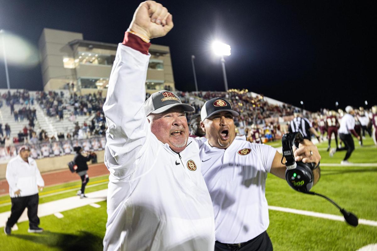 Saginaw Head Coach Mike Peters celebrates with an assistant coach after defeating Azle 41-39 in the Class 5A Division I playoffs game at Rough Rider Stadium in Saginaw on Friday, Nov. 15, 2024. This is Saginaw High School’s first playoff win in school history.
