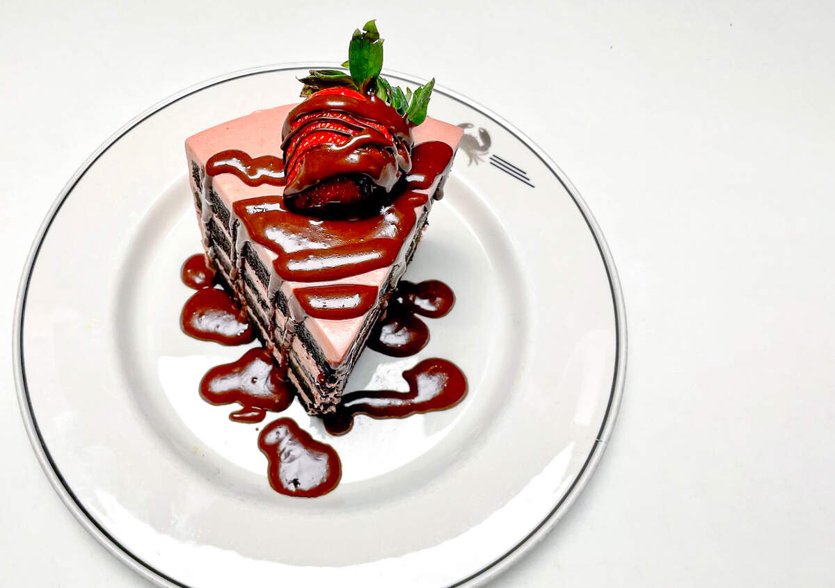 A Valentine’s Day chocolate strawberry cake from Trulucks features chocolate cake with strawberry cream cheese icing, topped with a chocolate-covered strawberry