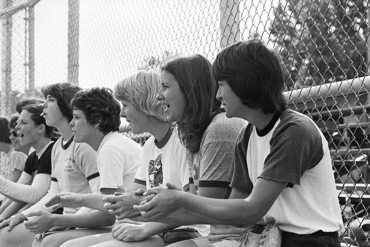 May 24, 1977: It’s a workout, but it’s still serious business for the UTA’s softball team, which is bound for the Association of Intercollegiate Athletics for Women championship. Encouragement during the practice play comes from the bench full of teammates at University of Texas at Arlington.
