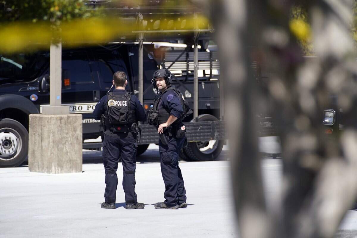 March 27, 2023; Nashville, TN, USA; Metro Nashville Police officers gather near Covenant School where three children and three adults were killed by a female shooter Monday, March 27, 2023 in Nashville, Tenn. The perpetrator was killed by police at the scene. Mandatory Credit: Andrew Nelles-USA TODAY NETWORK