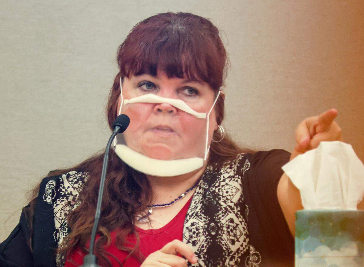 Patricia Owens, the mother of 18-year-old Amina Said and 17-year-old Sarah Said, points to her ex-husband, Yaser Said, on the third day of trial at the Frank Crowley Courts Building in Dallas on Thursday. Said, 65, was convicted on Tuesday, Aug. 9, 2022, of capital murder and received an automatic life sentence for killing his daughters on New Years Day 2008.