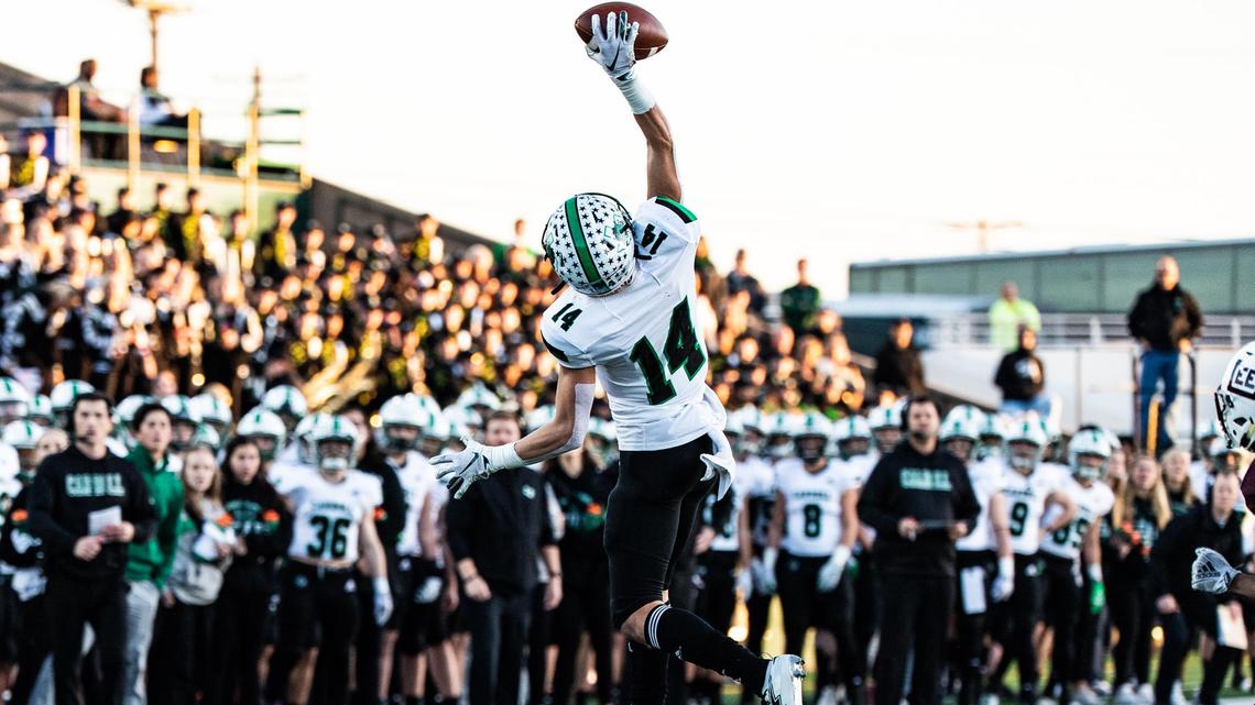Southlake Carroll’s Brady Boyd (14) makes a one-handed catch after quarterback Quinn Ewers threw an off-balance pass to avoid a sack against Midland Lee during the first quarter of a high school football playoff game at P.E. Shotwell Stadium in Abilene, Texas, Nov. 30, 2019.