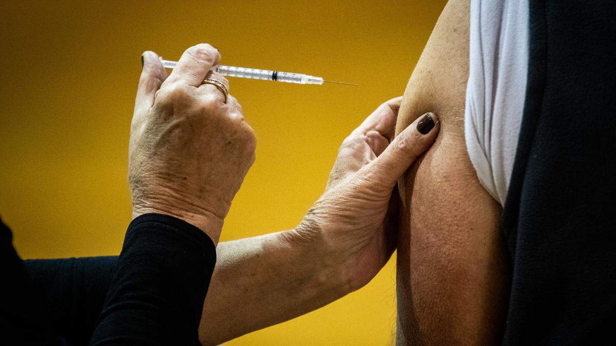 A nurse administers the COVID-19 vaccination at the new distribution hub Thursday, Jan. 21, 2021, at North Side Baptist Church in Weatherford. 