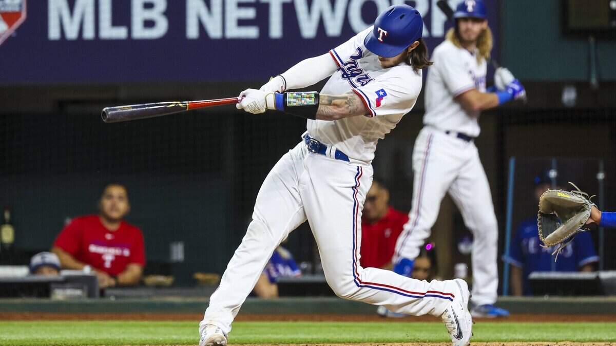 Texas Rangers catcher Jonah Heim (28) hits a walk-off three run home run during the tenth inning against the Kansas City Royals at Globe Life Field.