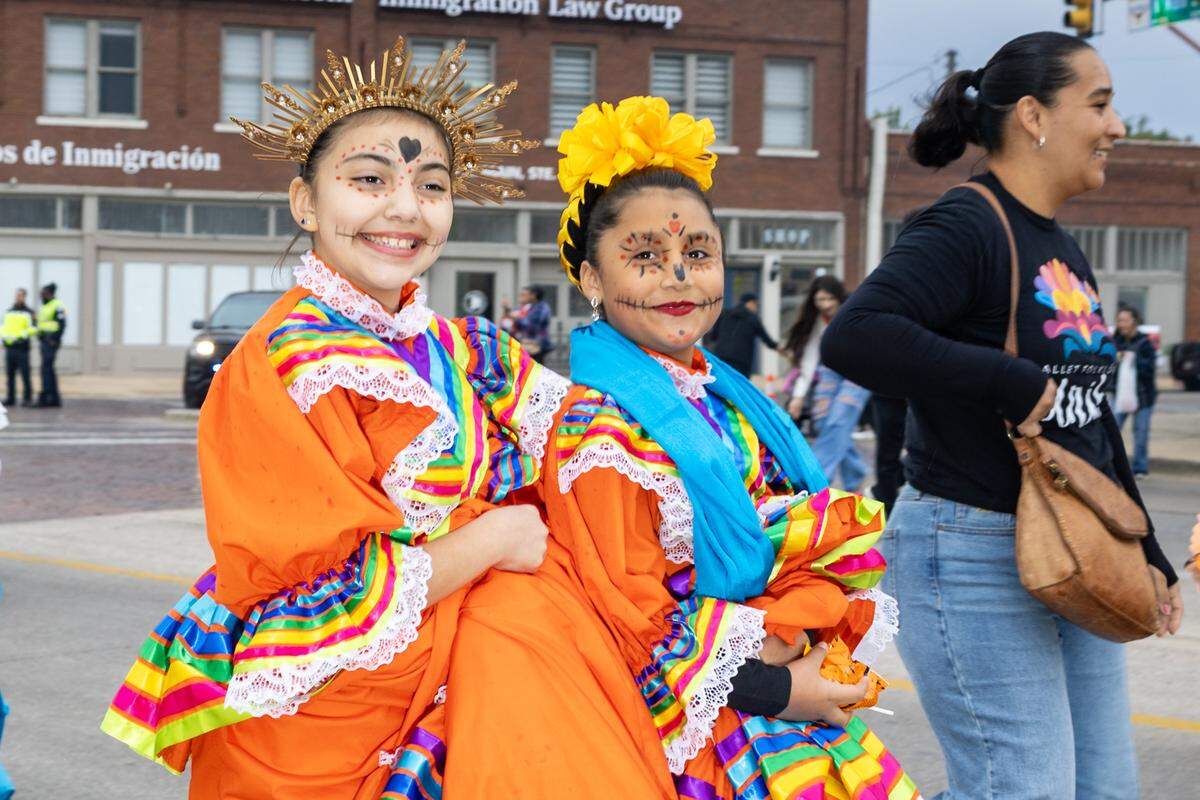 Parade participants walk down Main Street for the Dia De Los Muertos Parade in Northside Fort Worth on Saturday, Nov. 1, 2025.