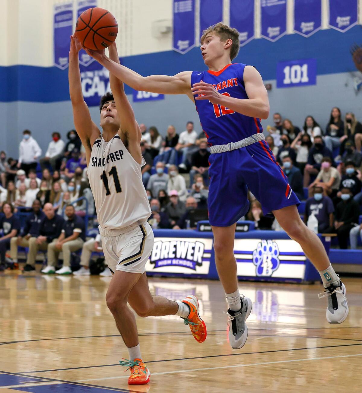 Colleyville Covenant guard Caleb Turner (12) goes for a rebound against Arlington Grace Prep guard Auri Bidgoli (11) during the first half of a TAPPS 4A Regional Round Boys Basketball playoff game played on March 6, 2021 at Brewer High School in Fort Worth TX. (Steve Nurenberg Special to the Star-Telegram)