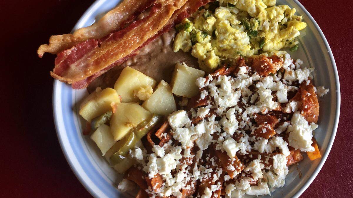 Chilaquiles Mexicanos with spicy red sauce at Fiesta Mexican Restaurant.