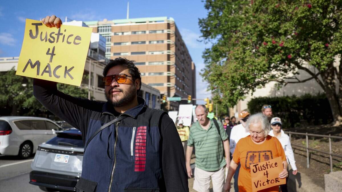 Stephan Sanchez marches with other community members rally to raise awareness and demand justice after four people died in 11 days in custody or immediately after being released from the Tarrant County Jail on Tuesday, July 14, 2026 in Fort Worth.