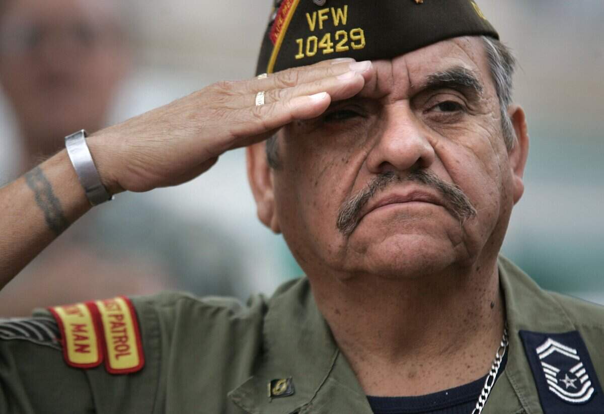 Nov. 11, 2008: Ruben Alarcon of Fort Worth, who served 24 years in the Air Force and did two tours in Vietnam, salutes during the presentation of the colors during the annual Veterans Day parade in Fort Worth.