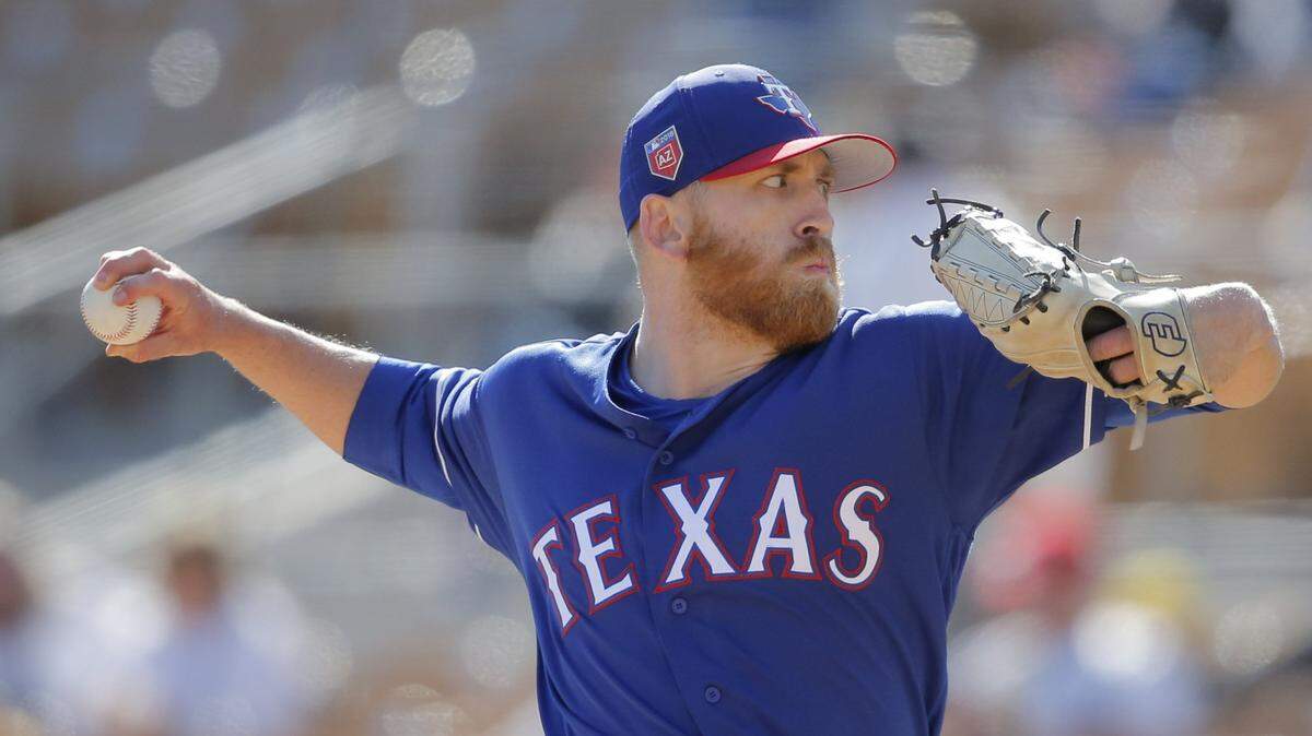Texas Rangers relief pitcher Reed Garrett (83) pitches as the Chicago White Sox beat the Texas Rangers 5-4 at Glendale, Arizona in spring training, Wednesday, February 28, 2018.