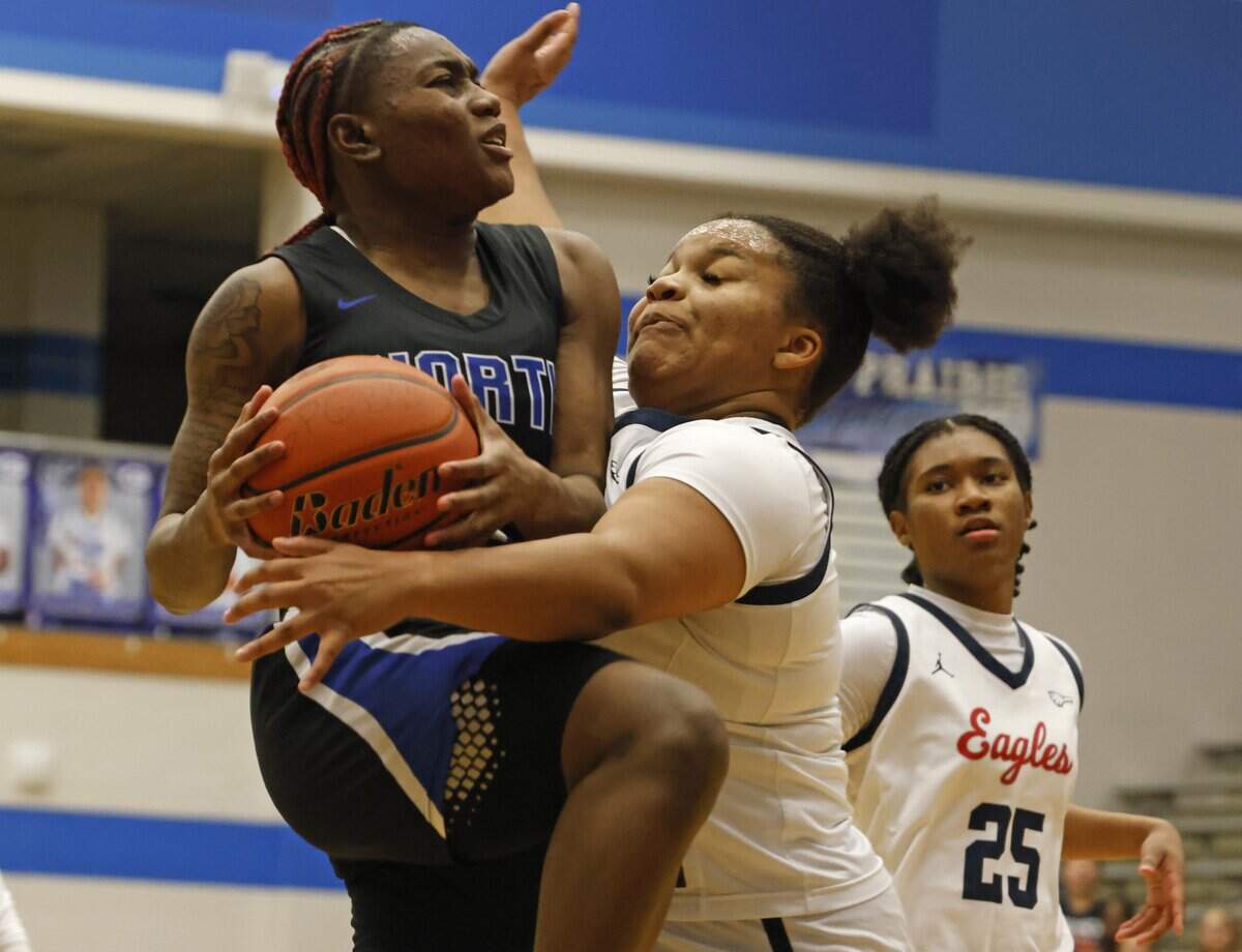 Allen forward Ashley Gatson (34) fouls North Crowley guard Jamari Milton (1) during the second half of a UIL Class 6A Division I girls regional semifinals basketball playoff game at Grand Prairie High School in Grand Prairie, Texas, Tuesday Feb. 24, 2026.