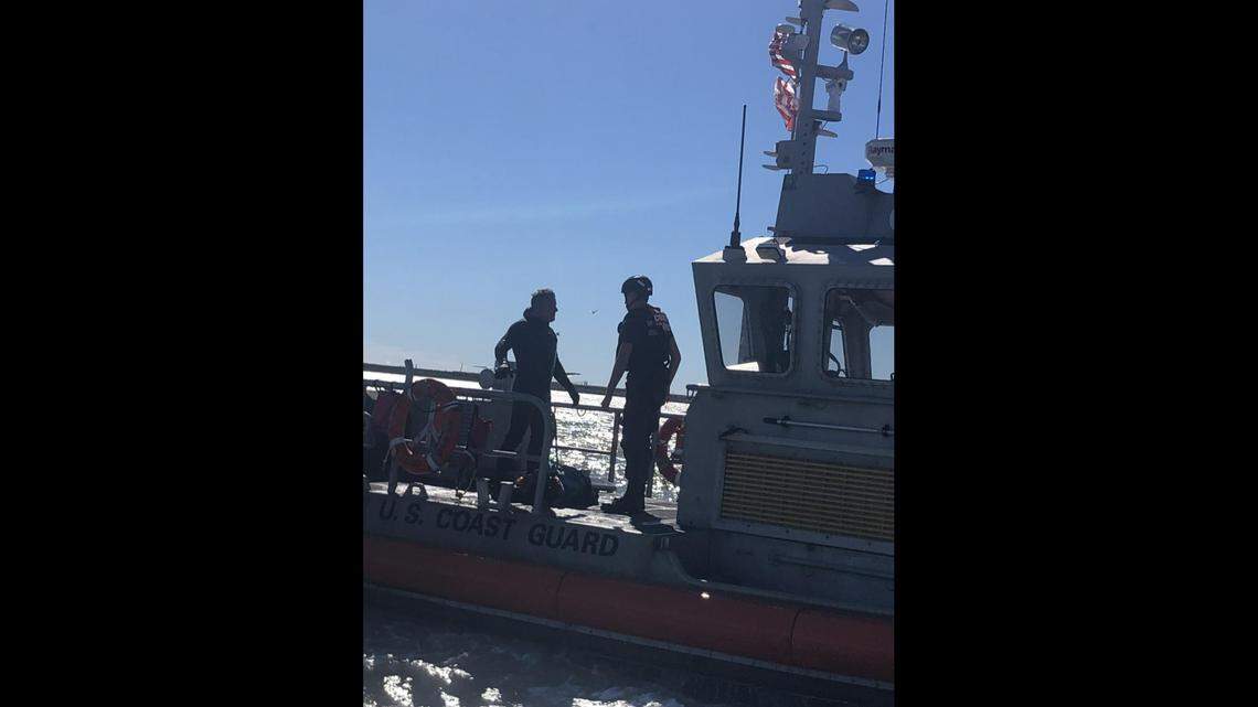 U.S. Coast Guard crews stationed in the Texas Gulf Coast rescued a kitesurfer spotted clinging to a floating piece of wood.