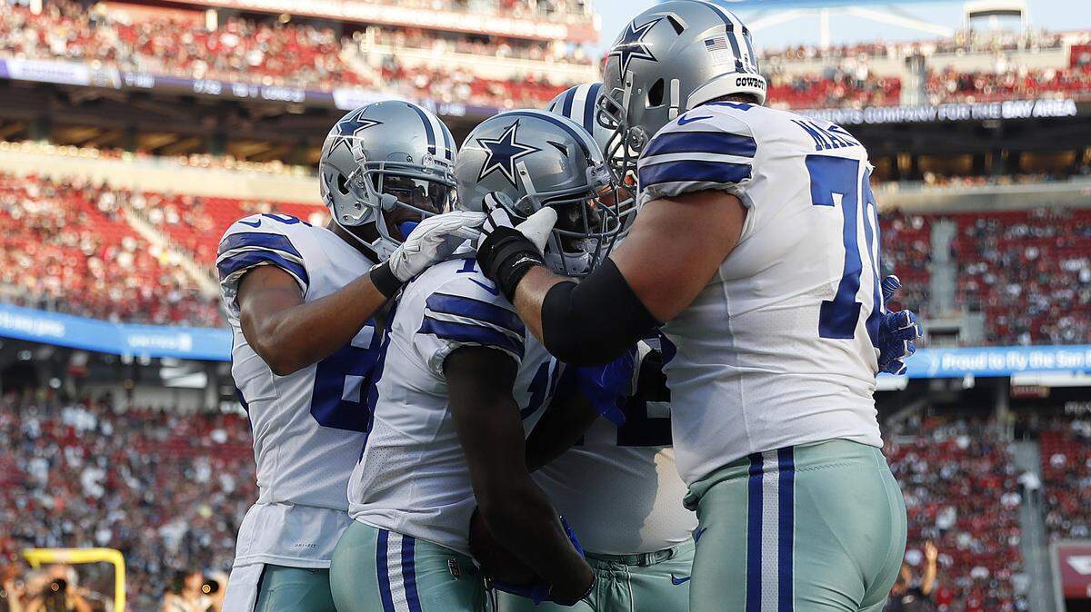 Dallas Cowboys wide receiver Michael Gallup, center, celebrates with teammates after scoring a touchdown against the San Francisco 49ers during the first half of an NFL preseason football game in Santa Clara, Calif., Thursday, Aug. 9, 2018.
