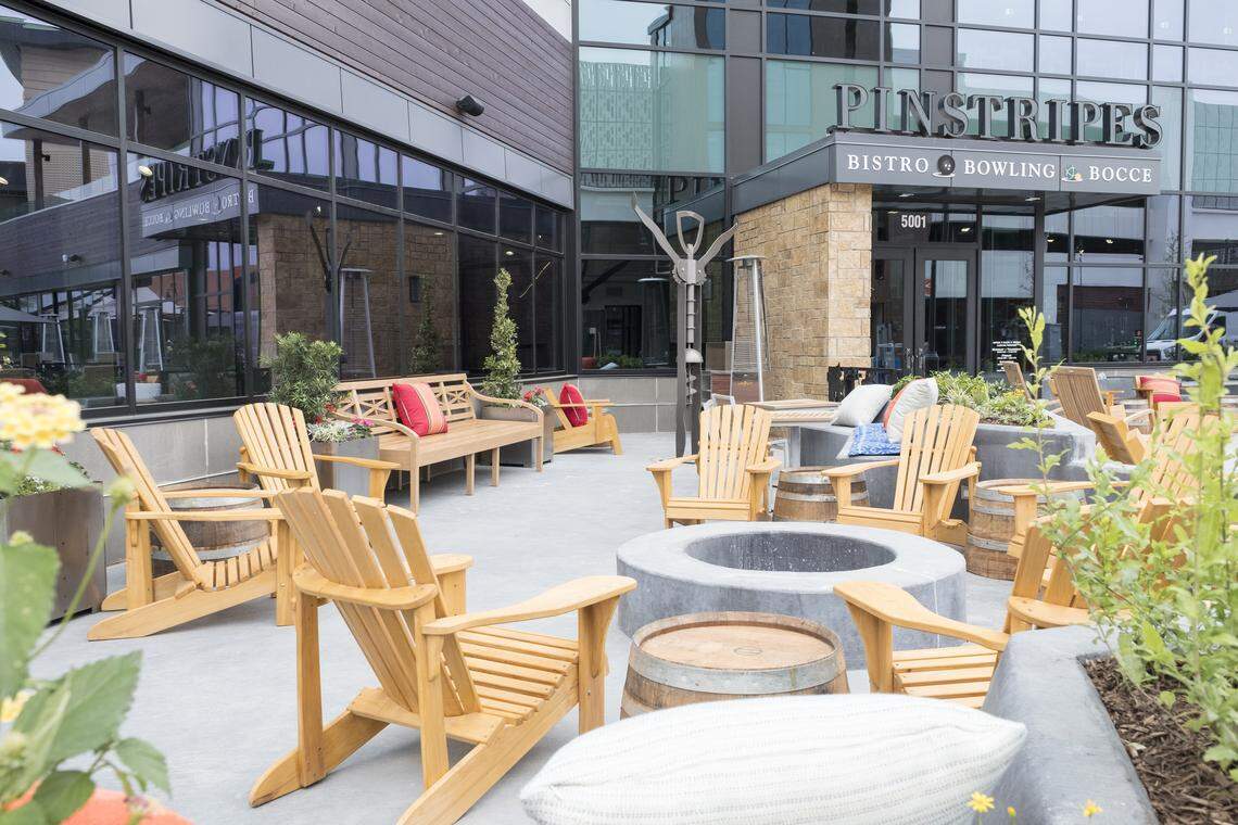 Part of the patio area at Pinstripes (Bistro + Bocce + Bowling) at the Shops at Clearfork in Fort Worth. Note the fire pit, the wine-barrel tables and the corkscrew sculpture -- a nod to Pinstripes’ wine program.