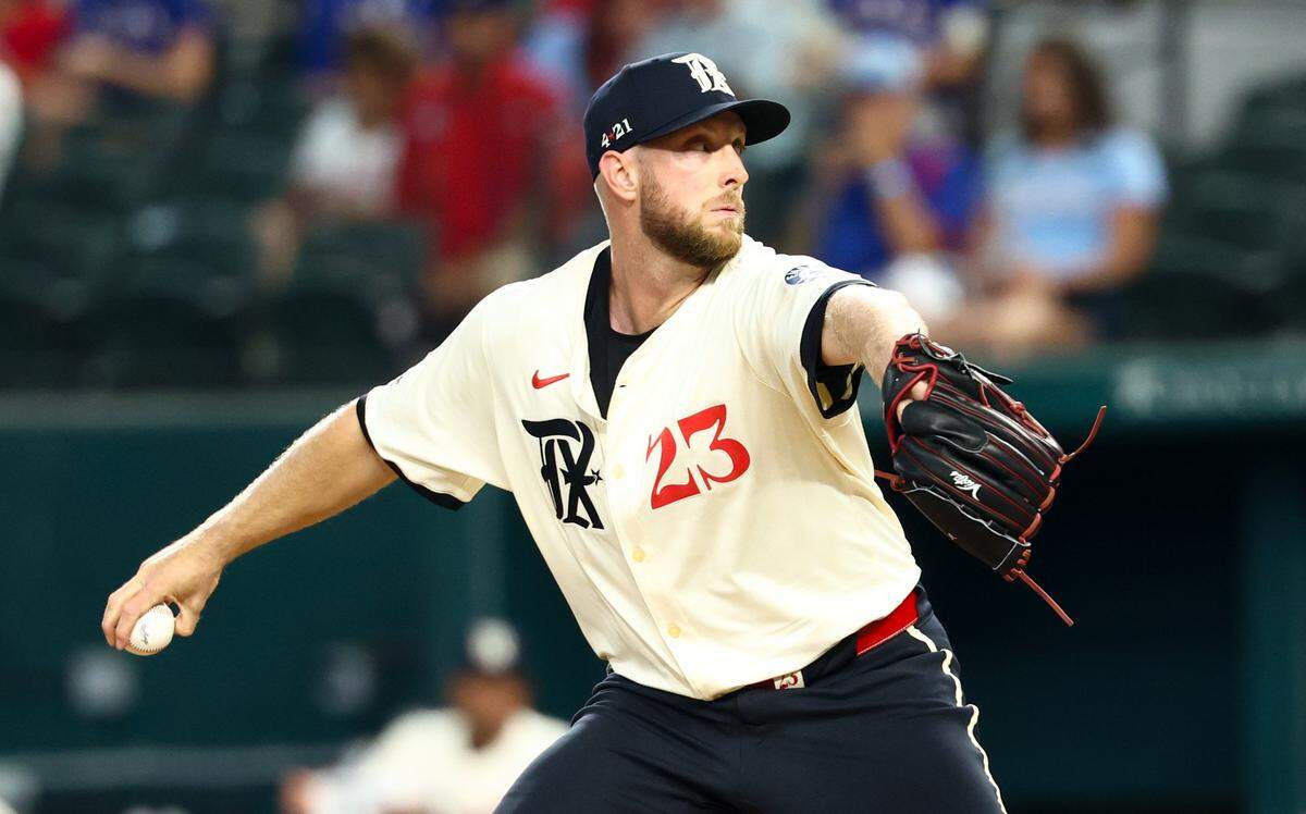 Aug 8, 2025; Arlington, Texas, USA; Texas Rangers starting pitcher Merrill Kelly (23) throws during the first inning against the Philadelphia Phillies at Globe Life Field. Mandatory Credit: Kevin Jairaj-Imagn Images