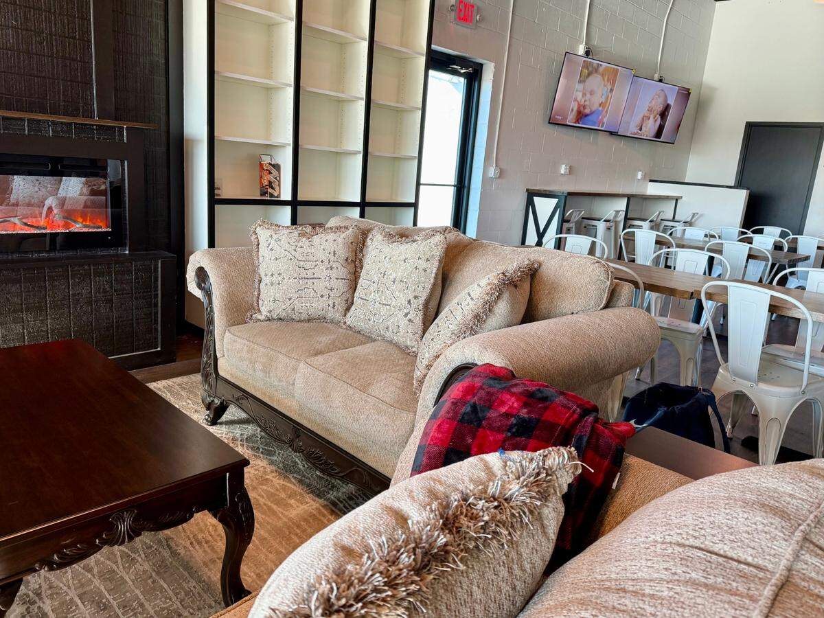 The interior of the new Sour Boule restaurant and bakery on the Benbrook Traffic Circle includes a fireplace and board game tables, as seen March 20, 2025.
