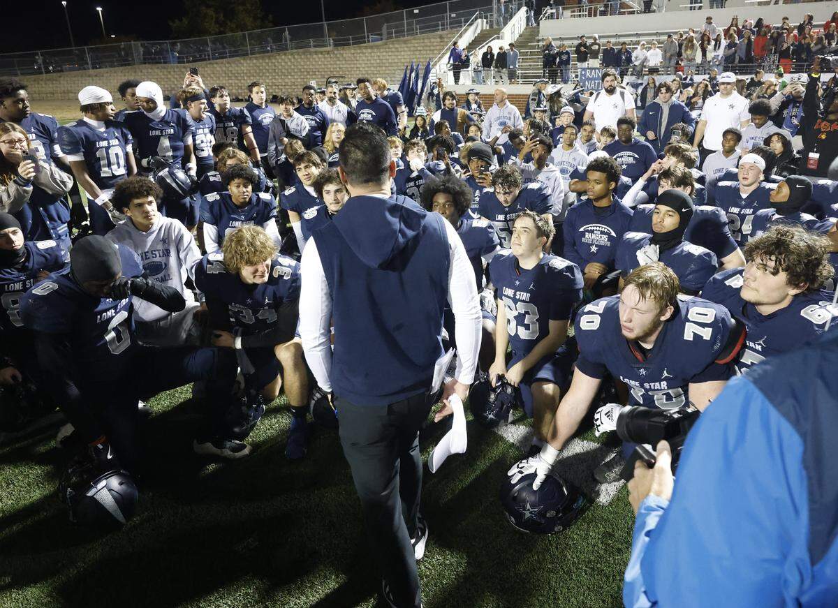 Frisco Lone Star head coach Jeff Rayburn talks to the Rangers after defeating Aledo in a UIL Class 5A Division I Semifinal on Friday Dec. 12, 2025 at Vernon Newsom Stadium in Mansfield, Texas.