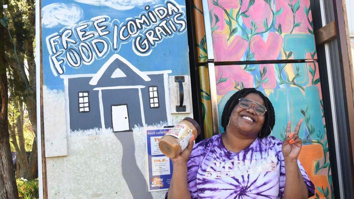 Kendra Richardson, in front of the Poly fridge, started Funky Town Fridge to give people access to food.