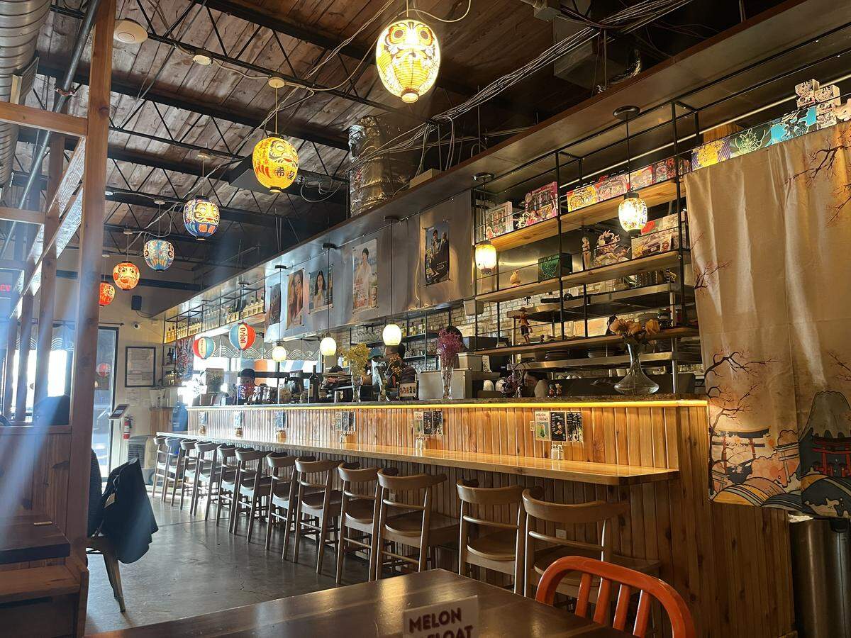 The inside space at Ichirō Izakaya in South Main of Fort Worth has bar seating with a view of charcoal grills, as well as booths and tables.