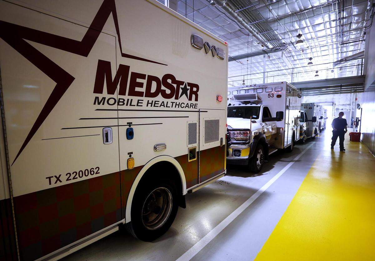 Ambulances at MedStar headquarters in Fort Worth prepare to be dispatched in May 2022. The Health Science Center contracted with MedStar Mobile Healthcare to administer vaccinations to homebound people.