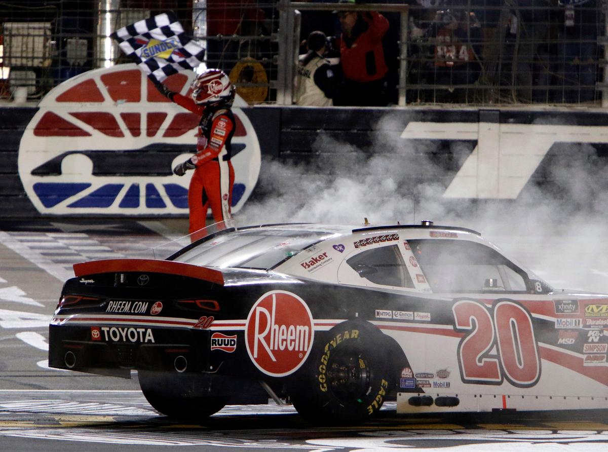 Christopher Bell waves the checkered flag at the finish line after winning the NASCAR Xfinity Series O’Reilly Auto Parts 300 at Texas Motor Speedway in Fort Worth, Texas, Saturday, Nov. 2, 2019.