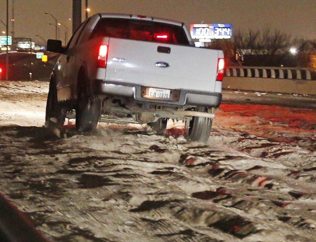 Cobblestone ice on bridges and overpasses makes travel treacherous overnight in Haltom City, on Saturday, Dec. 7, 2013, as low temperatures continues. TXDOT announced plans to have crews treat the cobblestone ice to make roads safer starting Sunday morning.
