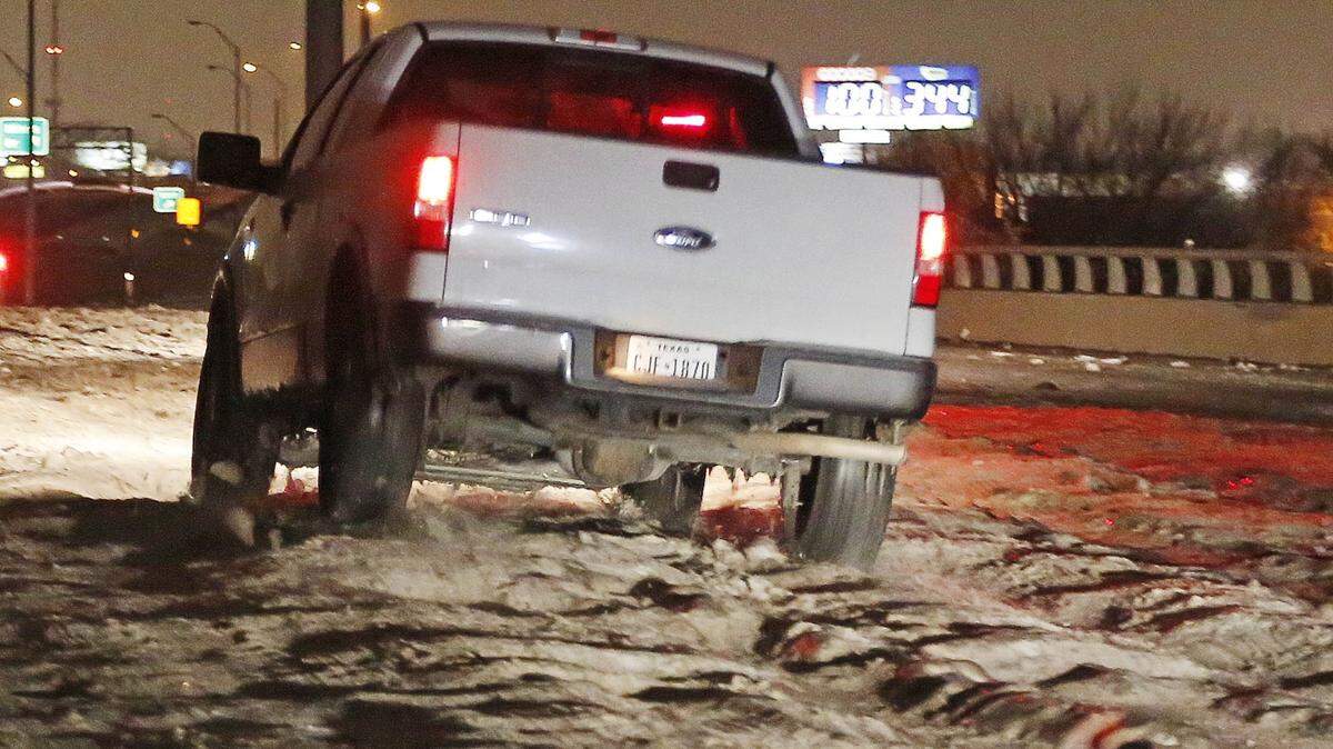 Cobblestone ice on bridges and overpasses makes travel treacherous overnight in Haltom City, on Saturday, Dec. 7, 2013, as low temperatures continues. TXDOT announced plans to have crews treat the cobblestone ice to make roads safer starting Sunday morning.