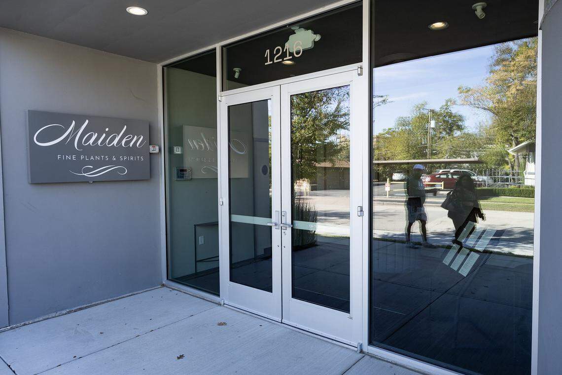 A couple walks by the now closed Maiden vegan restaurant on Magnolia Avenue in Fort Worth on Tuesday, Nov. 25, 2025.