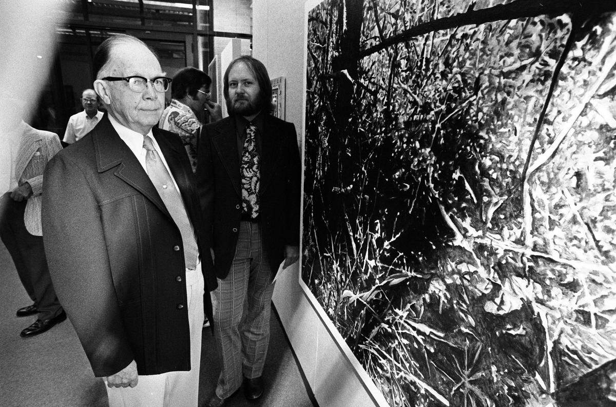 Oct. 13, 1975: Howard Joyner, left, chairman of the UTA art department from 1937 to 1969, stands with artist Jim Woodson beside the painting which friends of Joyner and the Arlington Art Association purchased for UTA in his honor. The painting is one of seven acquired by UTA.