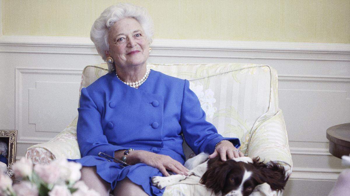 In this 1990 file photo, first lady Barbara Bush poses with her dog Millie in Washington. A family spokesman said Tuesday, April 17, 2018, that former first lady Barbara Bush has died at the age of 92.