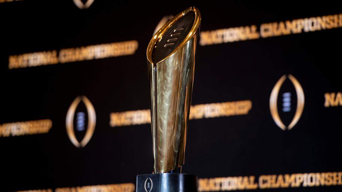 The championship trophy stands on a table during a news conference ahead of the national championship NCAA College Football Playoff game between Georgia and TCU, Sunday, Jan. 8, 2023, in Los Angeles. The championship football game will be played Monday.