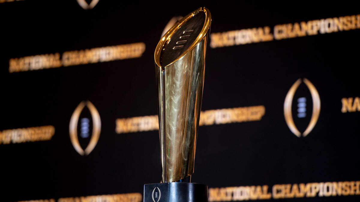 The championship trophy stands on a table during a news conference ahead of the national championship NCAA College Football Playoff game between Georgia and TCU, Sunday, Jan. 8, 2023, in Los Angeles. The championship football game will be played Monday.