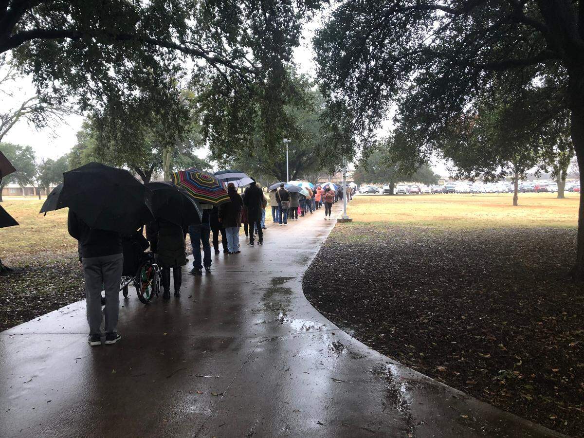 Hundreds of people waited in line to receive the COVID-19 vaccination on a rainy day in Fort Worth on Dec. 31. Some waited for more than an hour. 