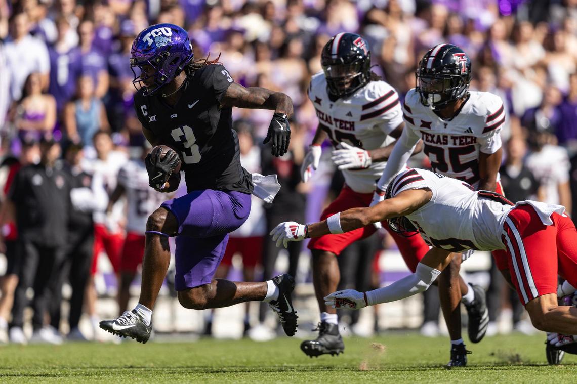 TCU wide receiver Savion Williams (3) leaps past the Texas Tech defense on the way to a touchdown in the first half of an NCAA football game between TCU and Texas Tech at Amon G. Carter Stadium in Fort Worth on Saturday, Oct. 26, 2024.