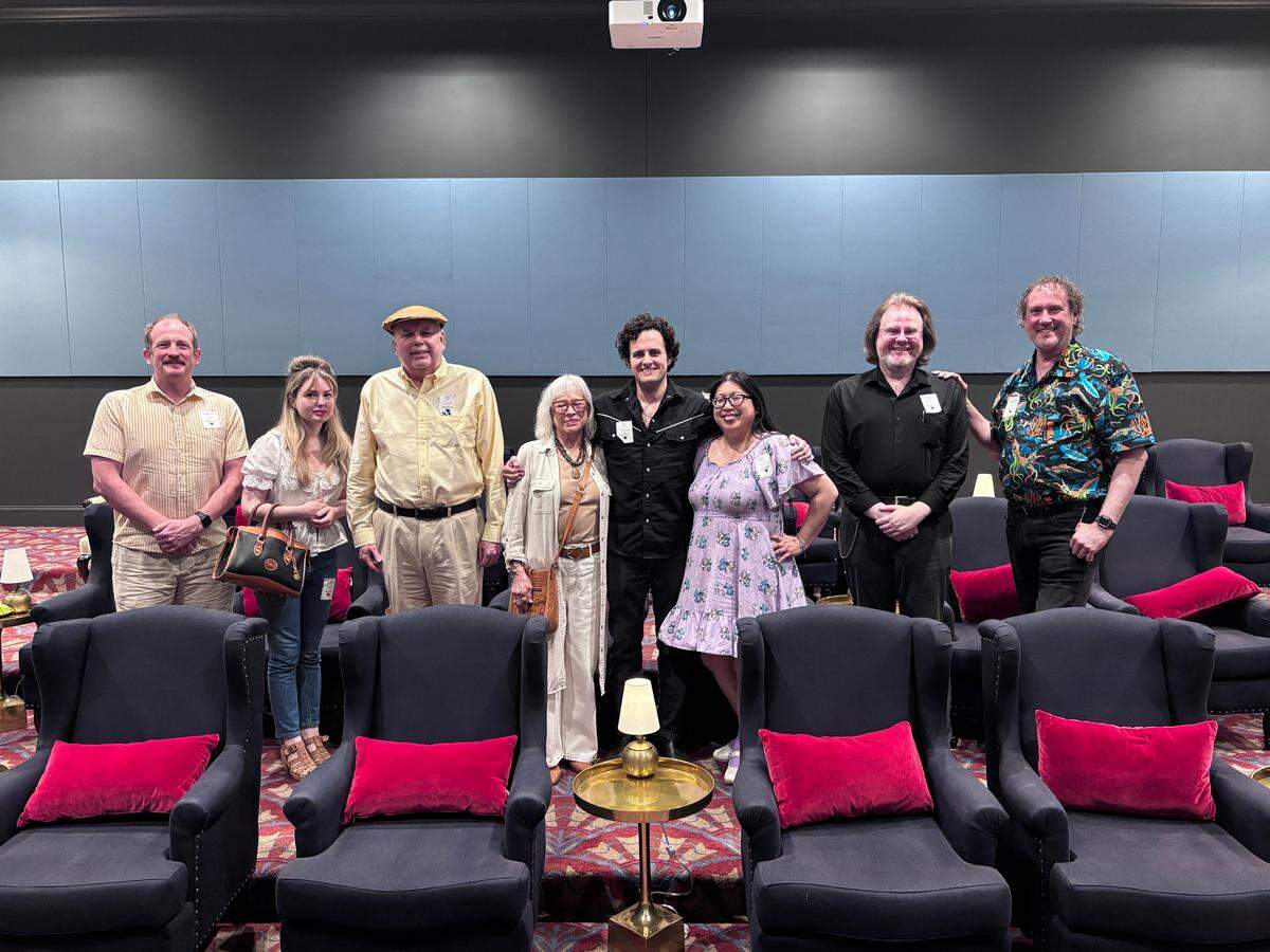 Ryan Bijan Jeri, center, founder of Cowtown Movie Classics, with some of his regulars at a screening of 1939’s “Hound of the Baskervilles” in Fort Worth on Oct. 13, 2025.