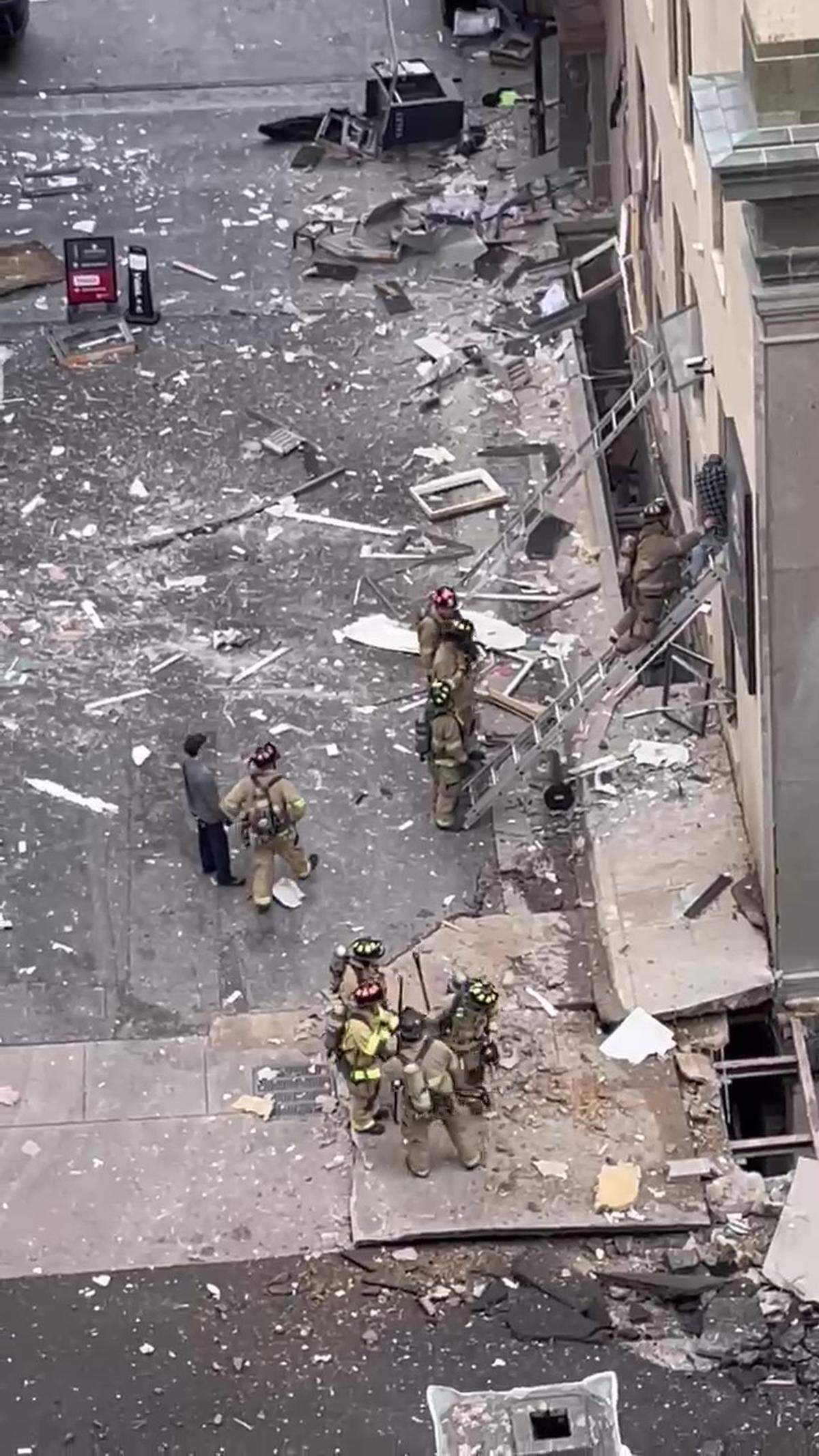 Firefighters respond to an explosion in the basement of the Sandman Signature Hotel in downtown Fort Worth on Monday. The blast blew out windows on the first and second floors of the 20-story hotel.