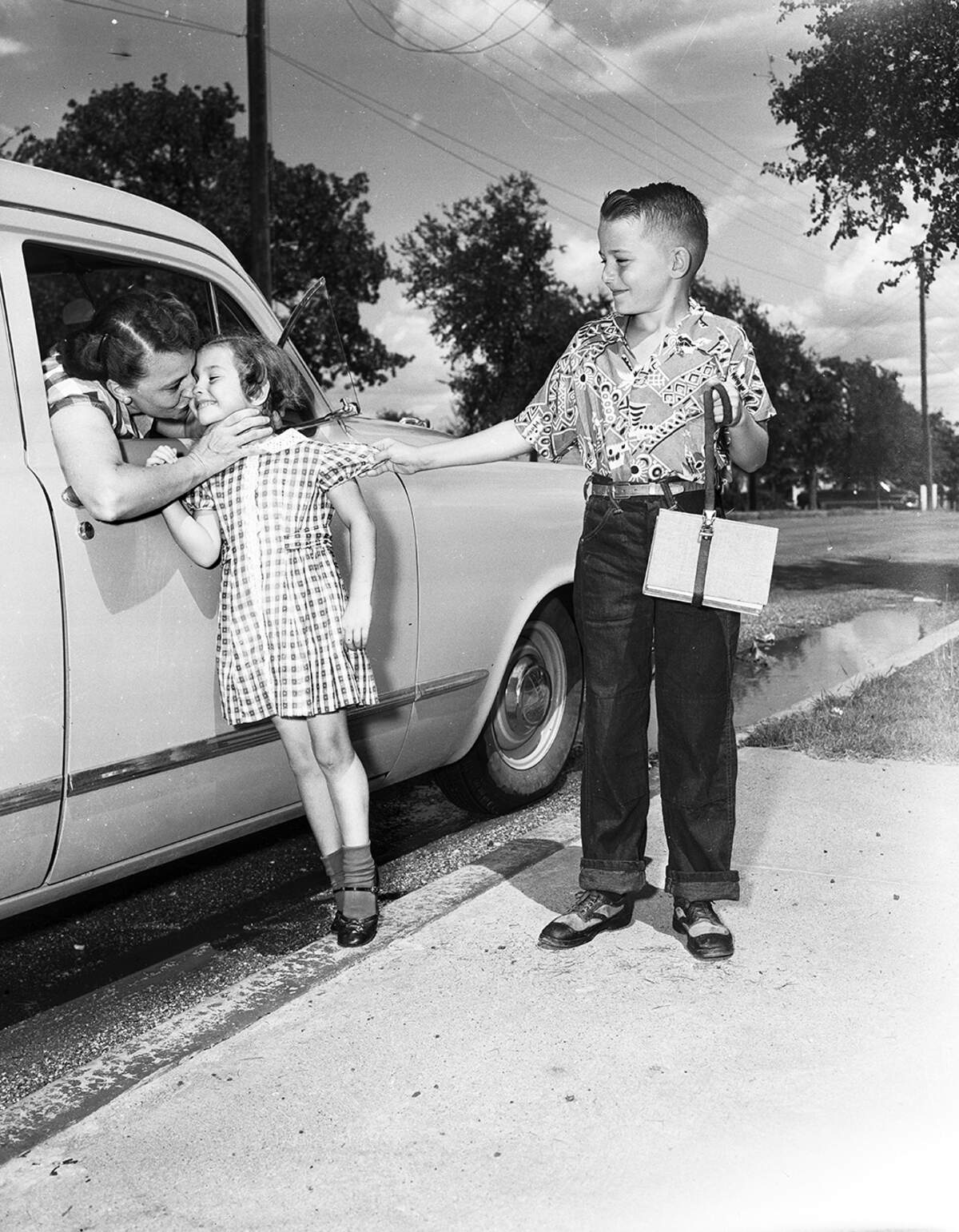 Aug. 28, 1953: Paul Steinmetz, Carolyn Steinmetz and their mother Mrs. A.P. Steinmetz. Carolyn is starting her first day of first grade at S.S. Dillow School. The Steinmetz family lived at 1828 Arch.