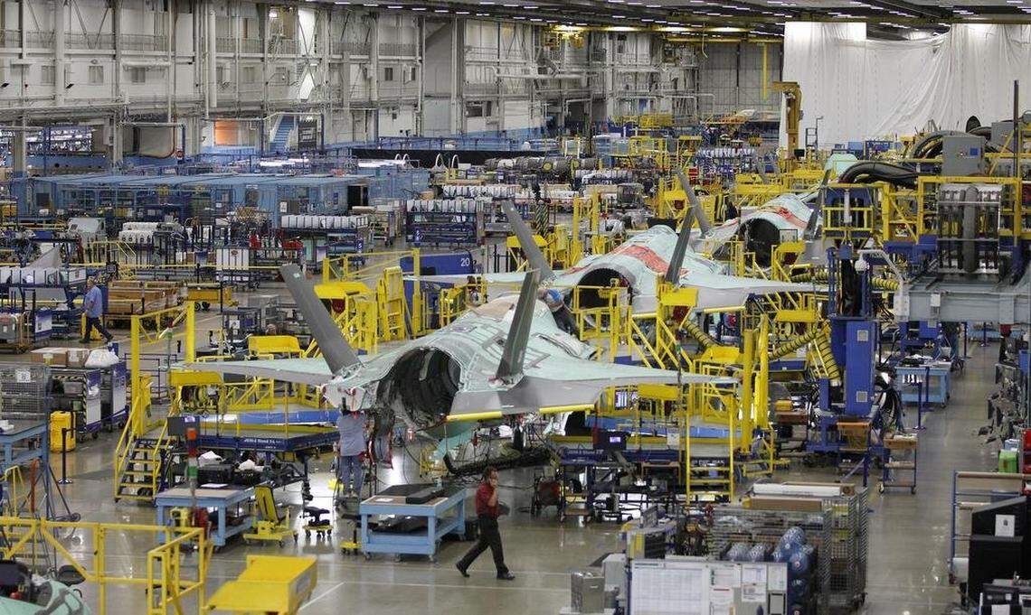 A fighter jet on the assembly line. 