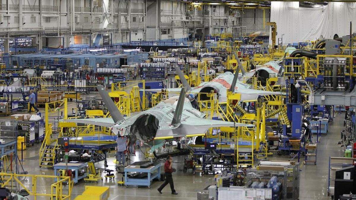 A fighter jet on the assembly line. 