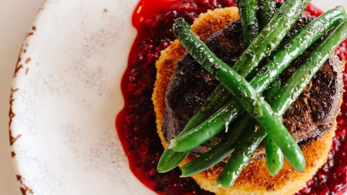 Coriander-cured beef tenderloin with Ecuadorian potato cake and cranberry mojo on chef Stephan Pyles’ Valentine’s week menu at Fireside Pies.