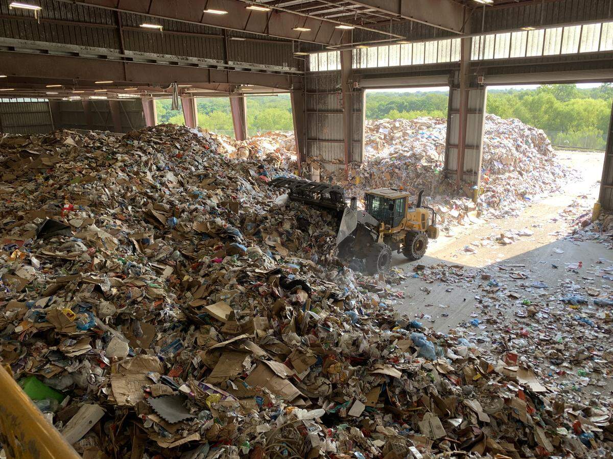 Hundreds of tons of recyclables are ready to be sorted at Republic Services’ facility in Fort Worth.