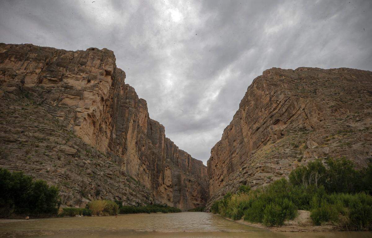 The cliffs of Santa Elena Canyon rise above the river in Big Bend National Park along the Rio Grande River on the United States border with Mexico, Tuesday, April 25, 2017.